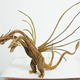 Image for article titled Godzilla Made from Pine Tree Branches Is a Lovely Fire Hazard